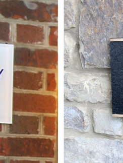 a sign on a brick wall