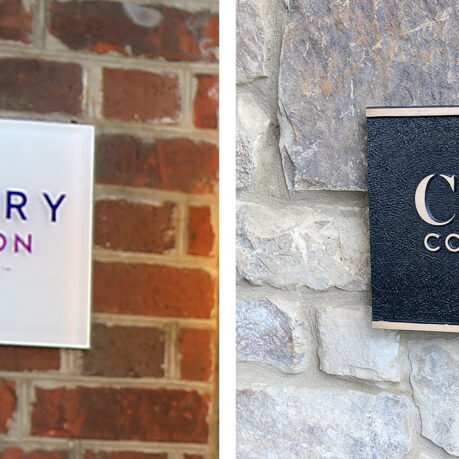 a sign on a brick wall