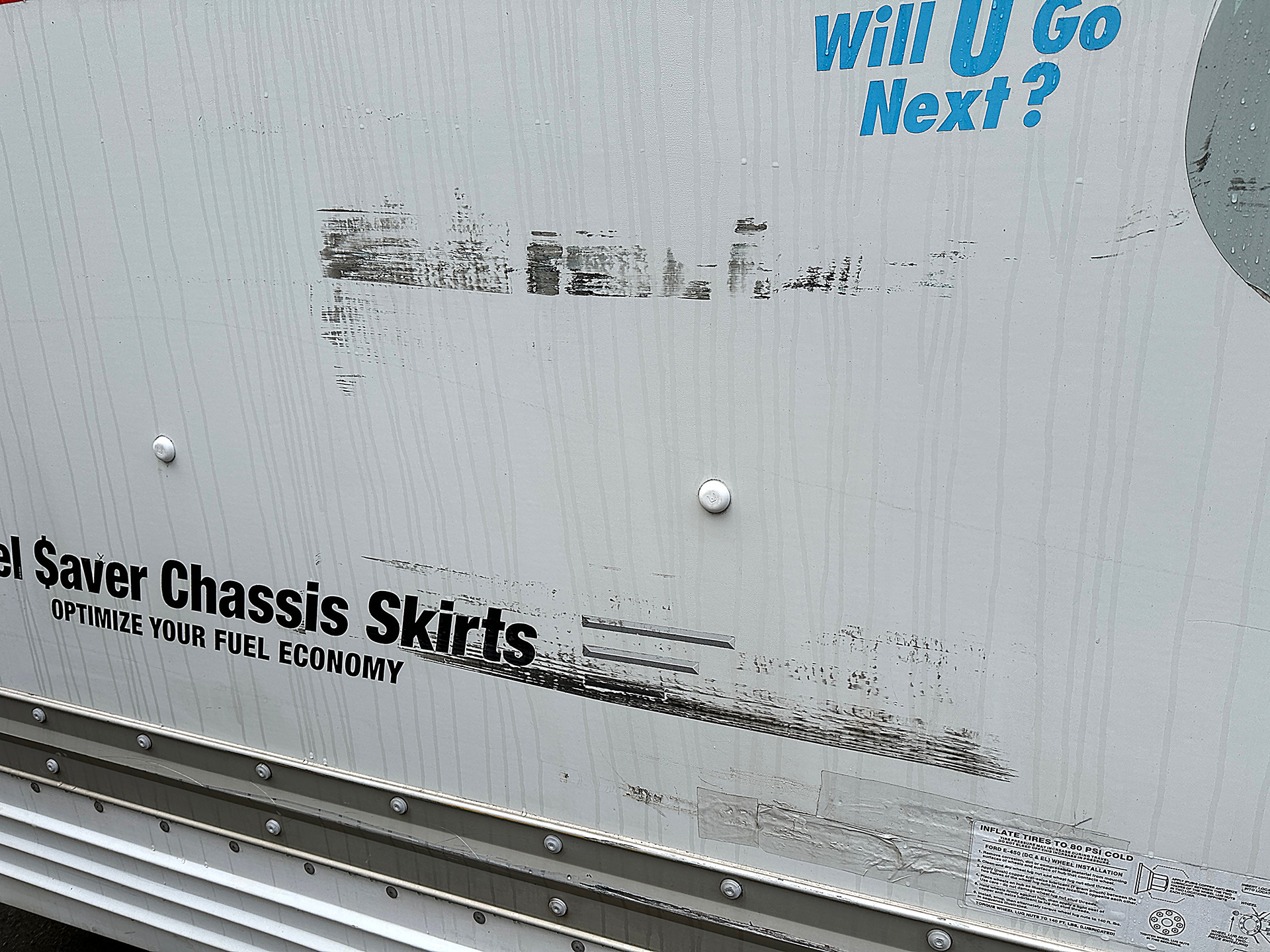 a white truck with black text on it