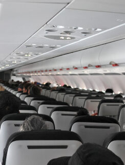 a group of people sitting in an airplane