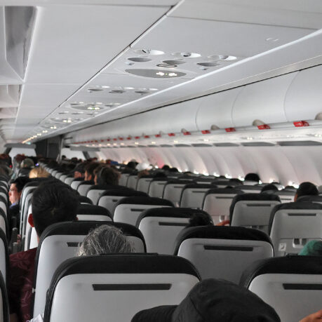 a group of people sitting in an airplane