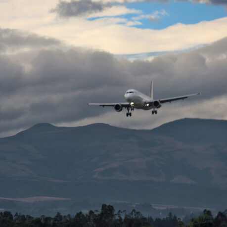 an airplane flying over mountains