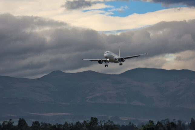 an airplane flying over mountains