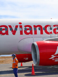 a man standing next to a large airplane