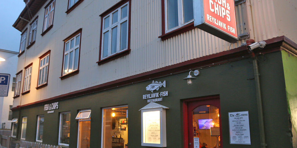 a building with a fish and chips sign