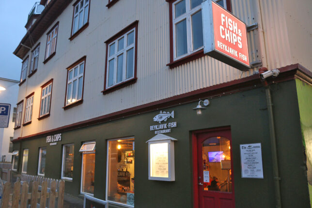 a building with a fish and chips sign