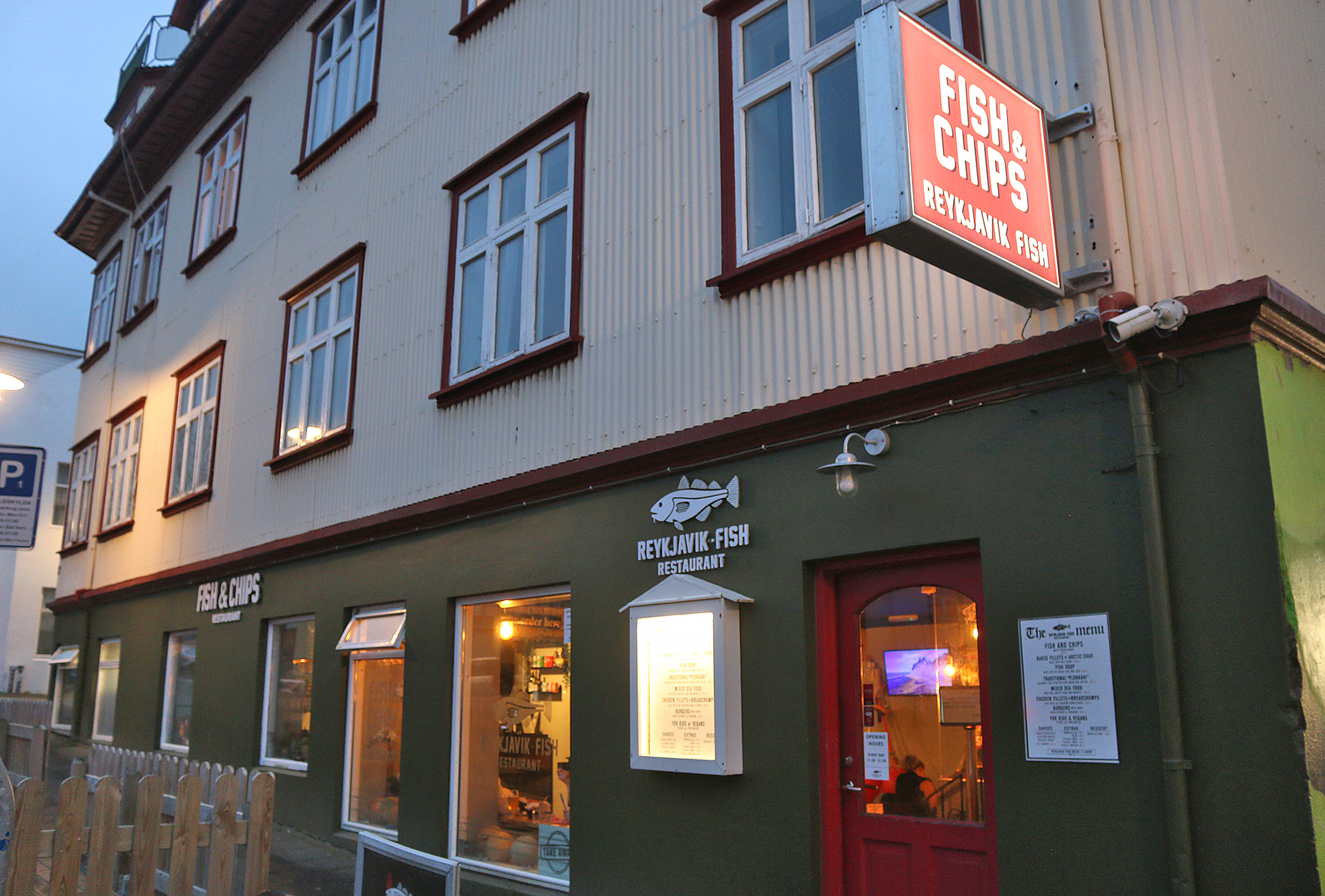 a building with a fish and chips sign