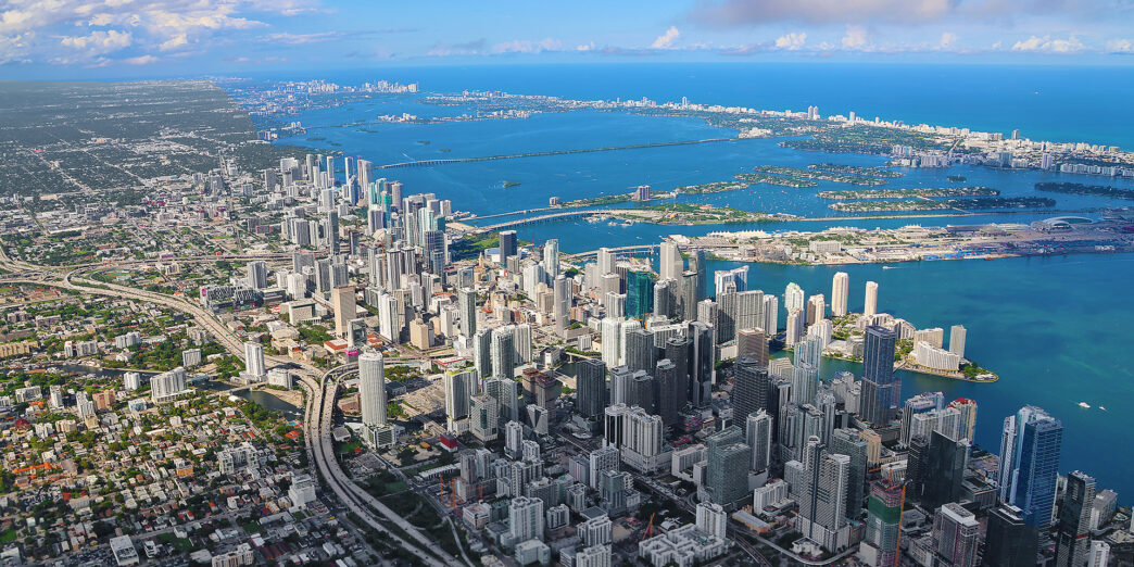 a city with many buildings and a body of water