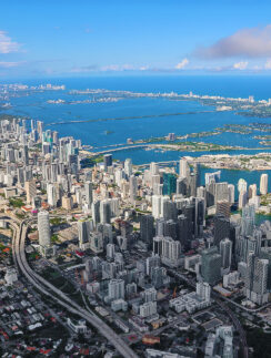 a city with many buildings and a body of water