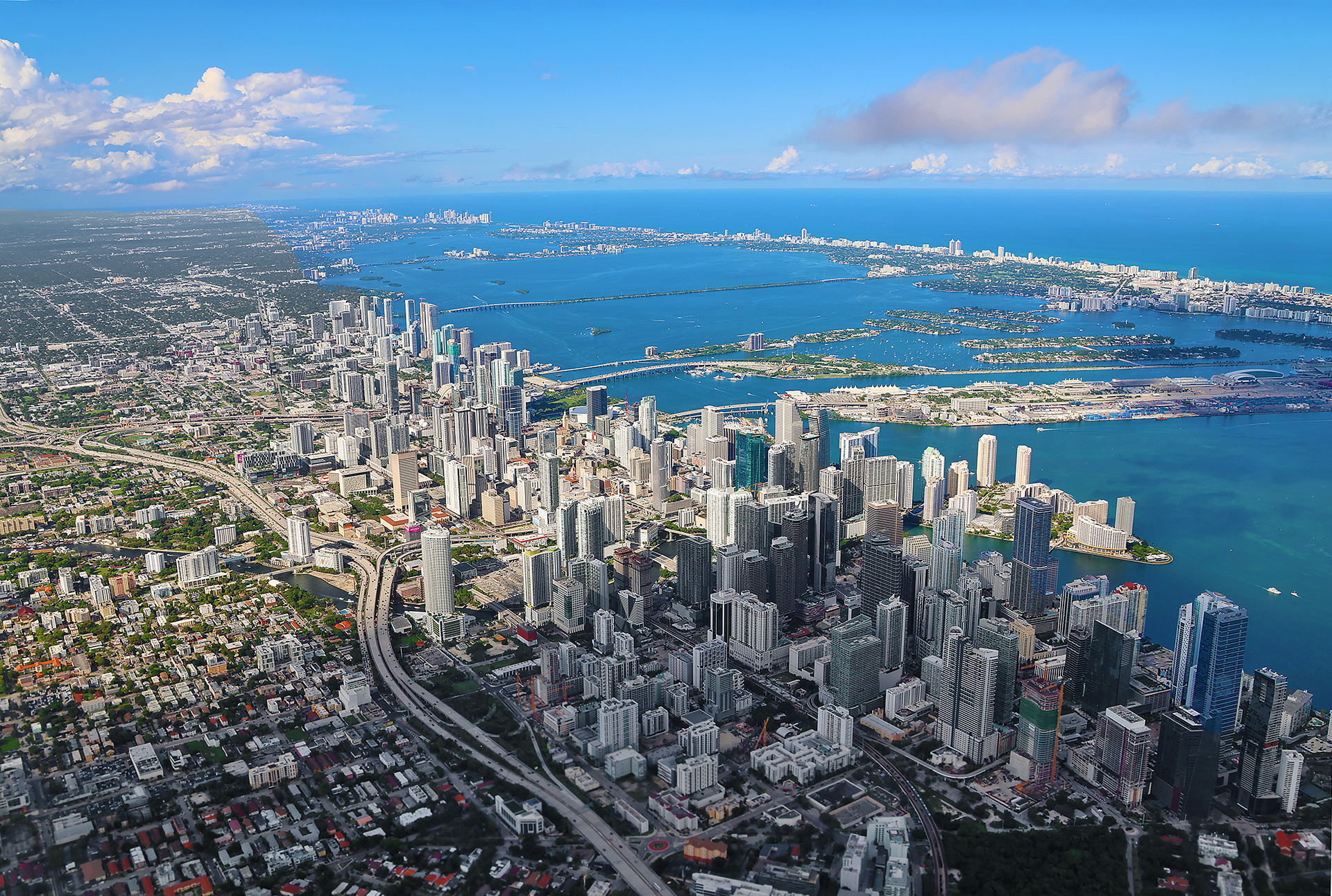 a city with many buildings and a body of water