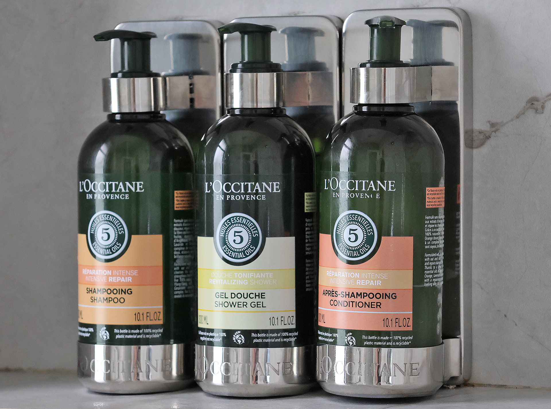 a group of bottles of shampoo and shower gel