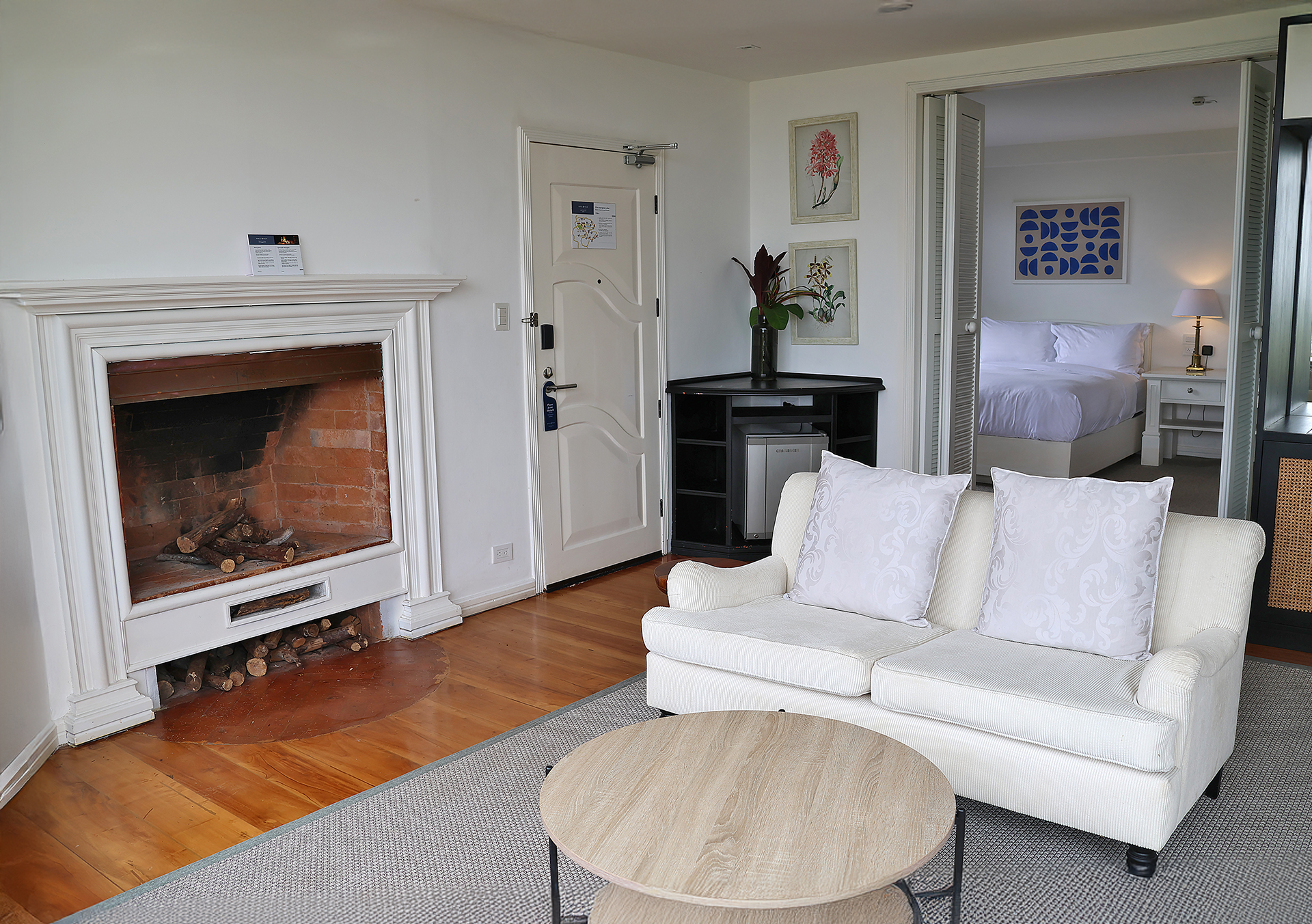 a living room with a fireplace and a couch