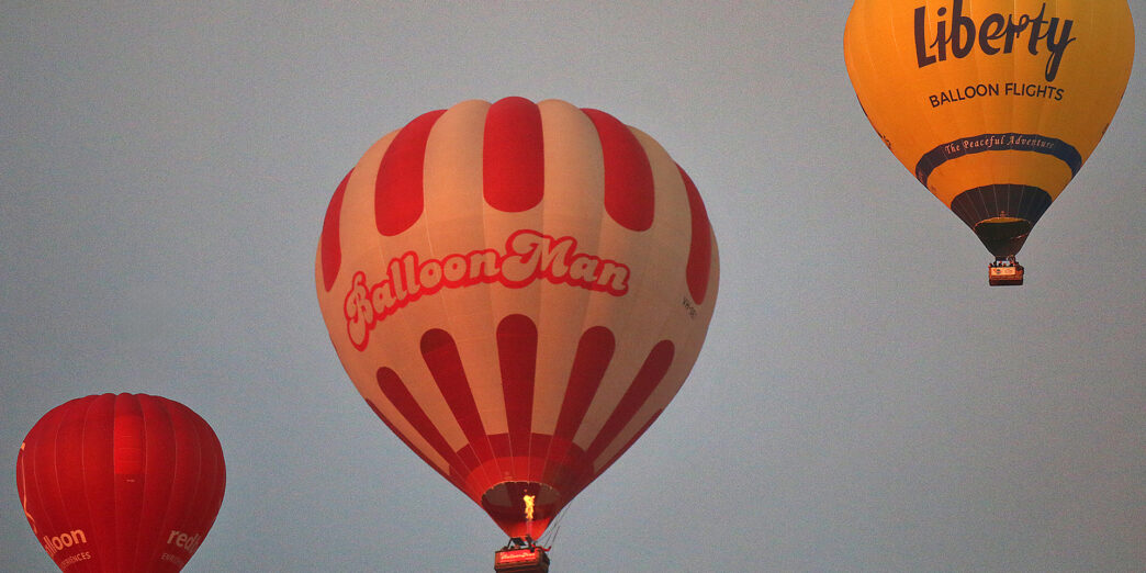 a group of hot air balloons in the sky