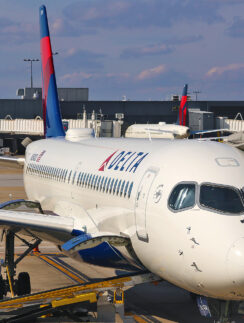 a white airplane with a red and blue tail