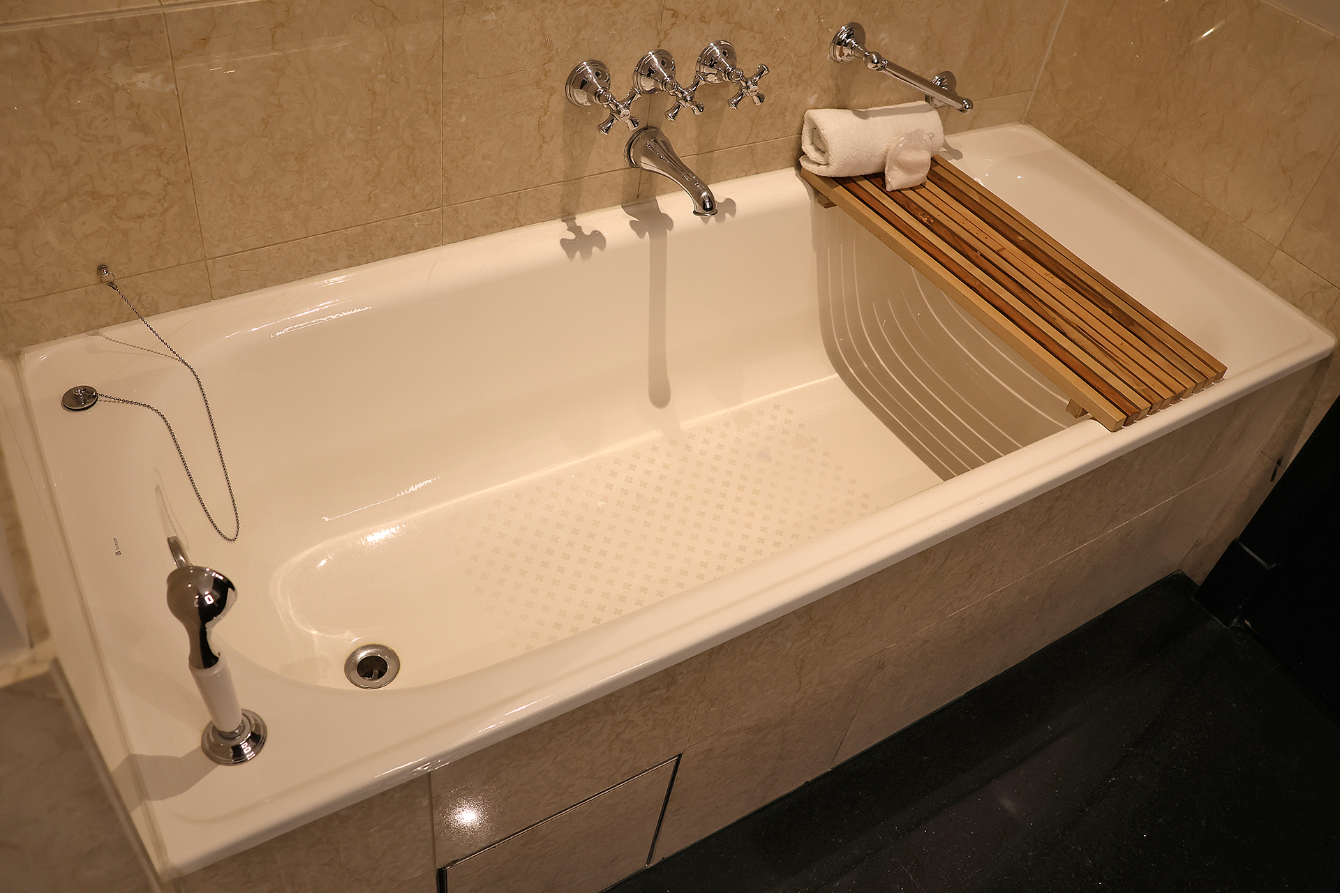 a bathtub with a towel rack