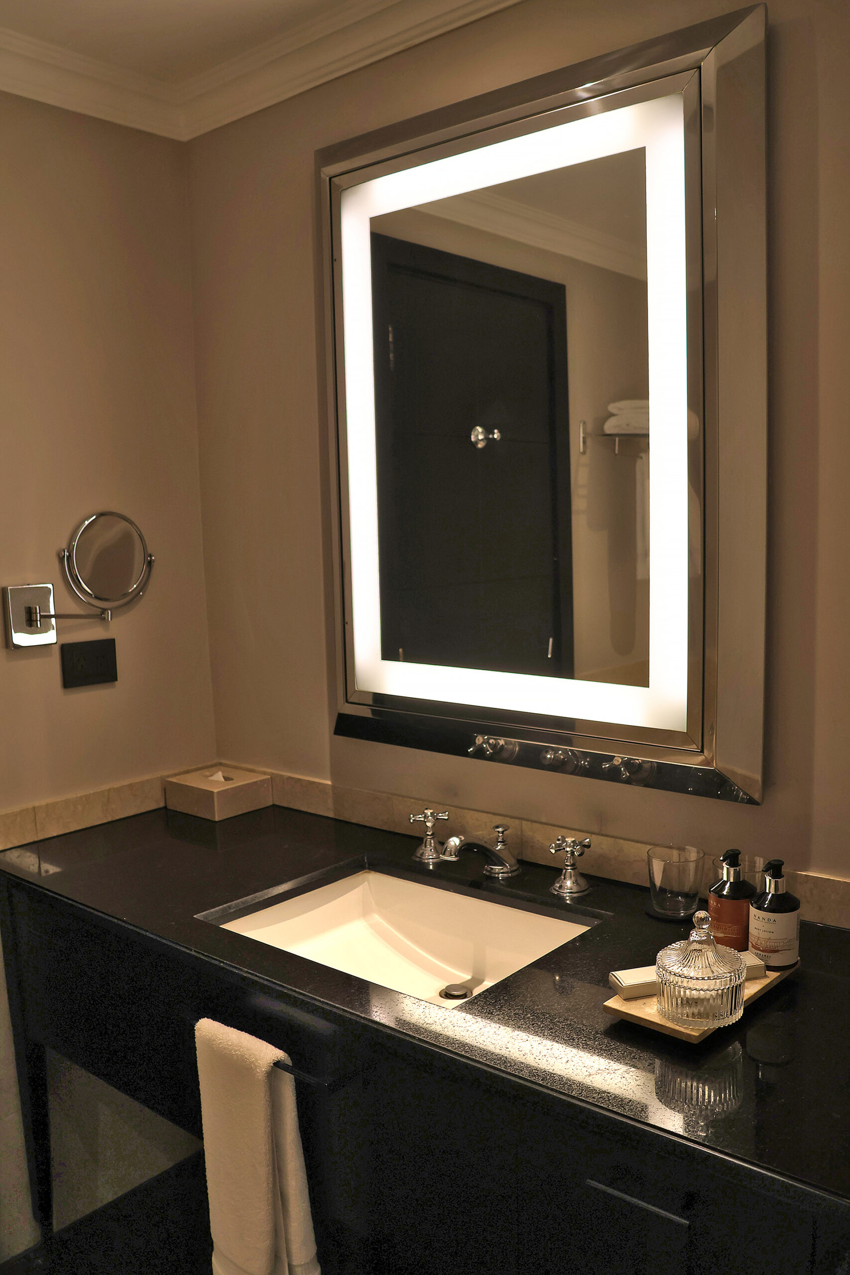 a bathroom with a mirror and sink