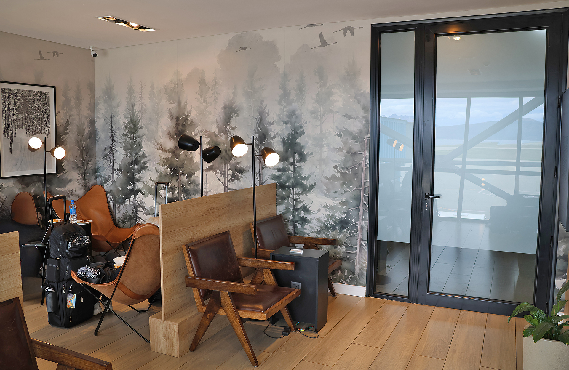 a room with a wallpaper and chairs