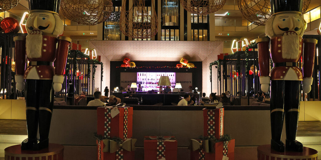 a large room with presents and a bar