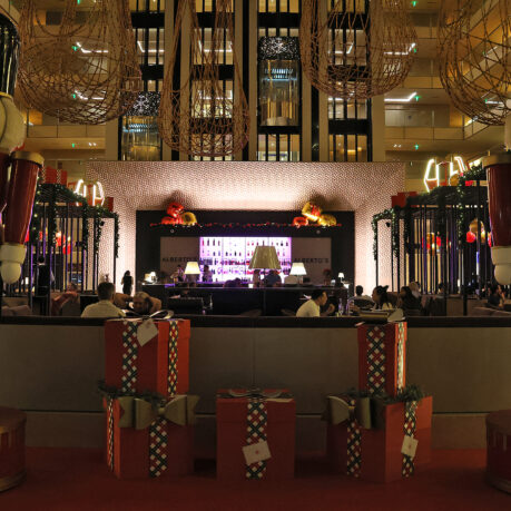 a large room with presents and a bar