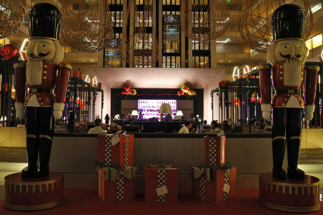 a large room with presents and a bar