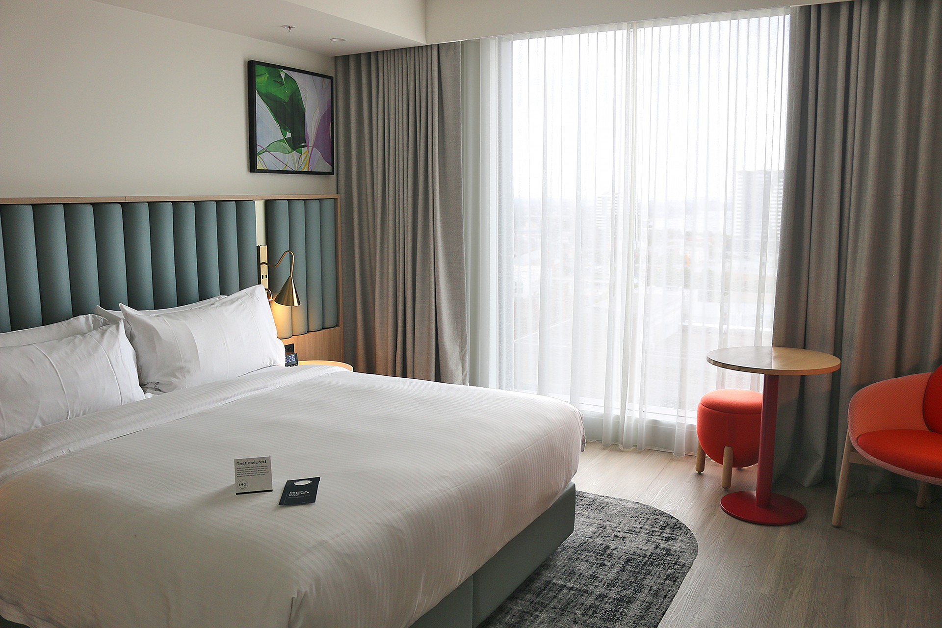 a hotel room with a bed and a table