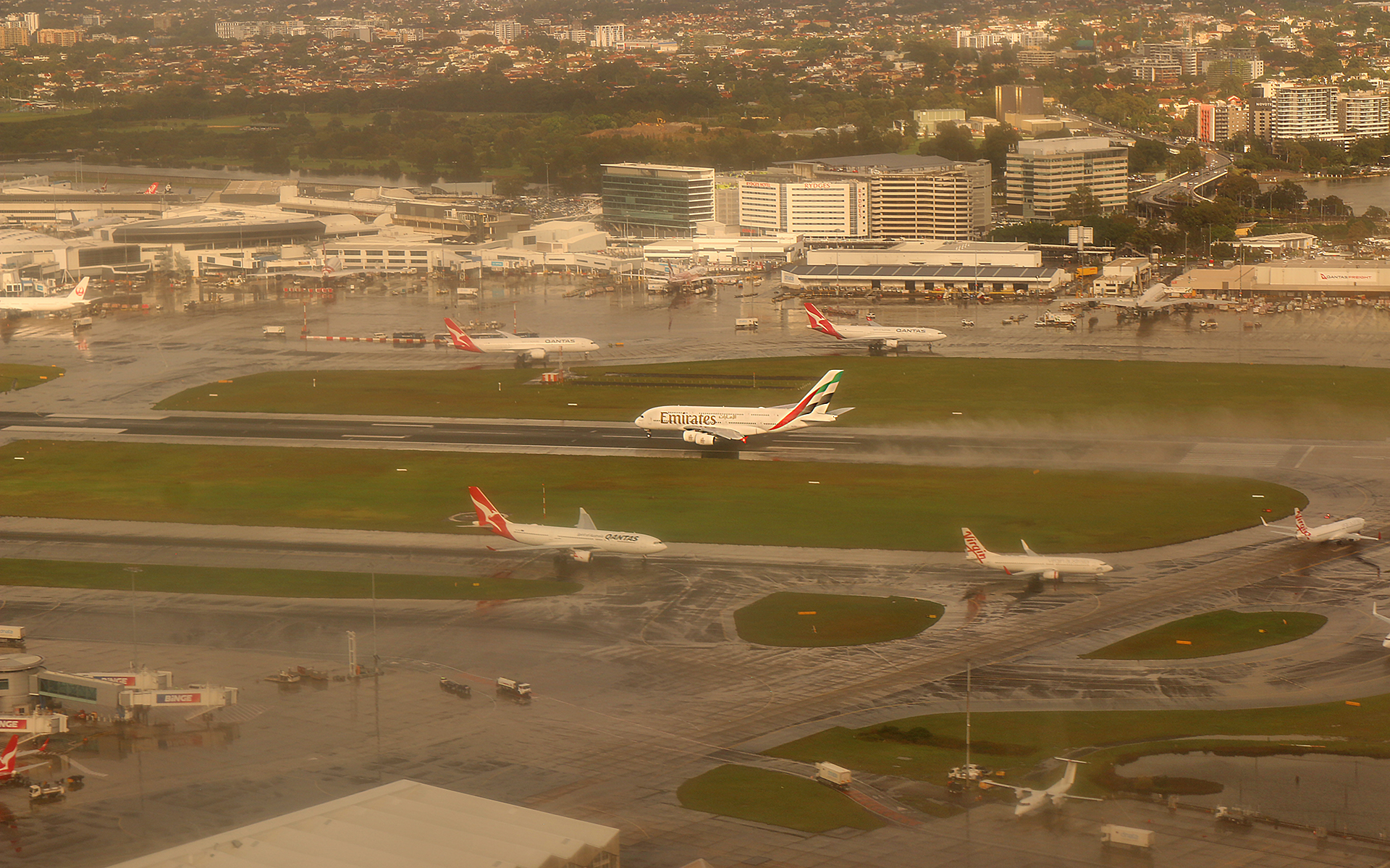 an aerial view of airplanes on a runway