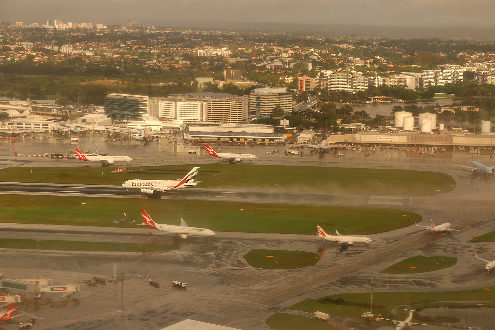 an aerial view of airplanes on a runway