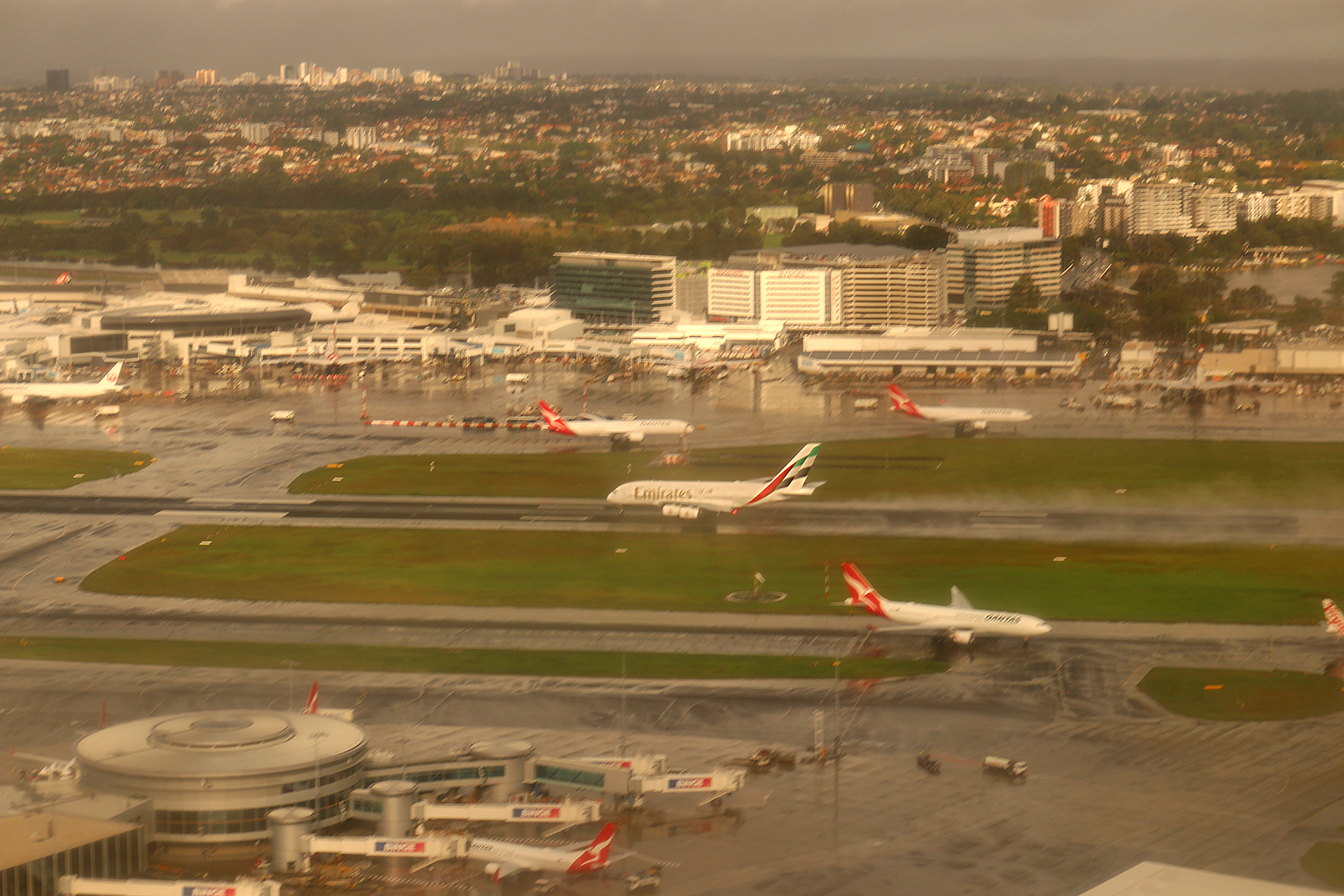 an aerial view of airplanes on a runway
