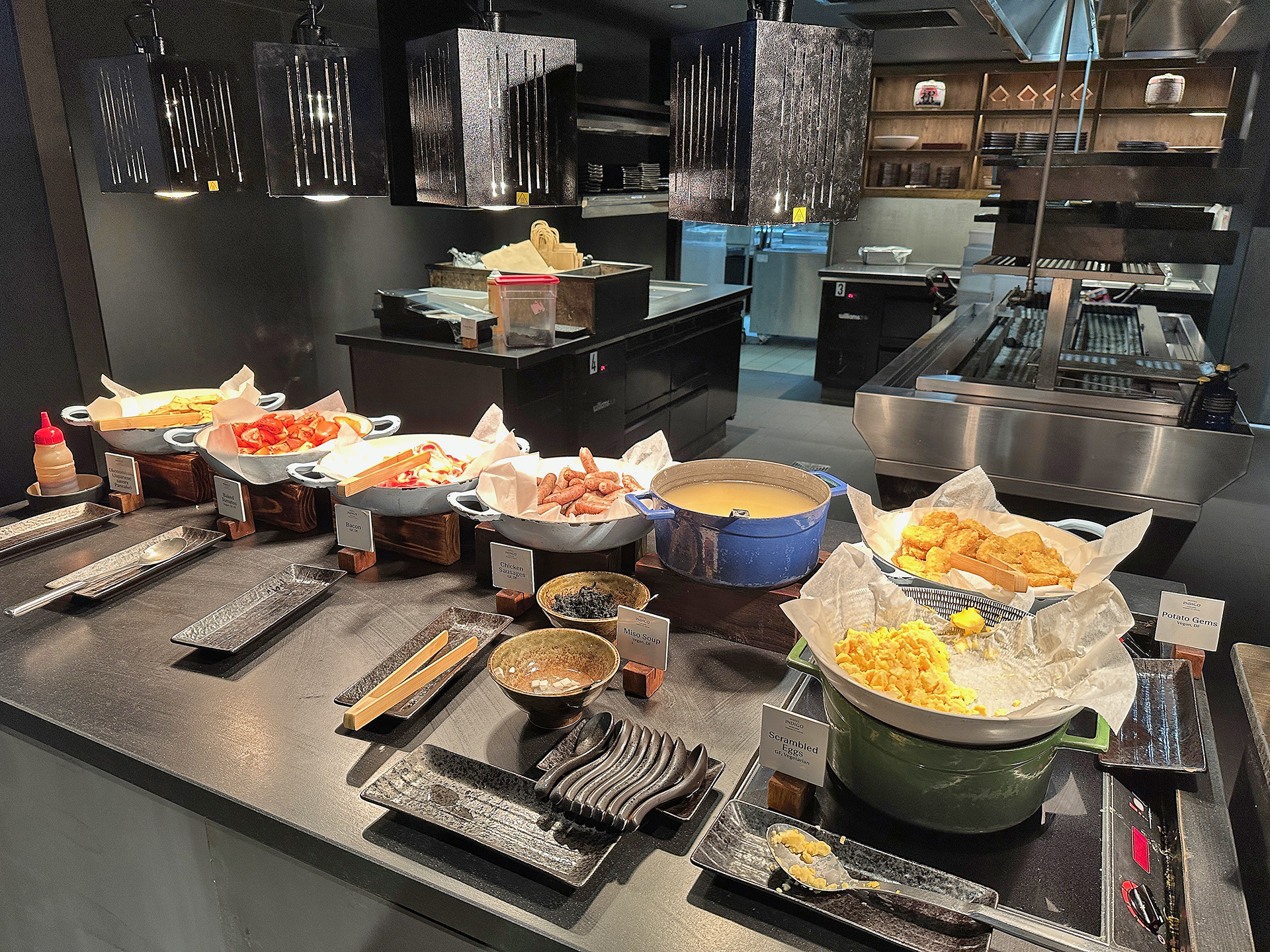 a kitchen with many bowls of food