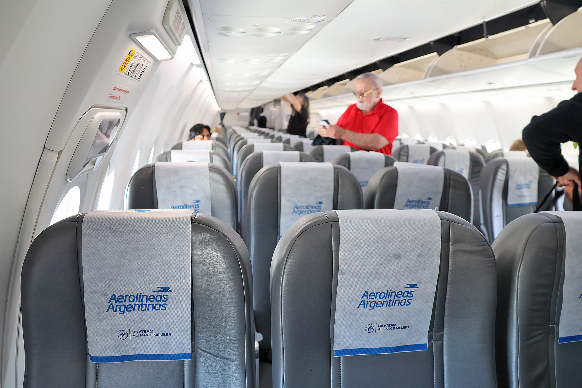 a man standing in an airplane