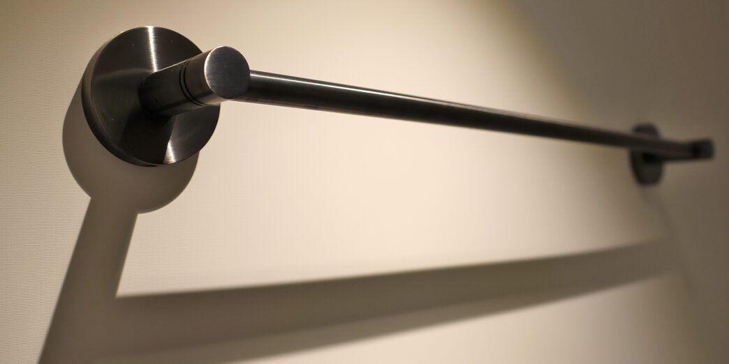 a metal bar on a wall