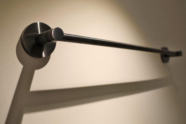 a metal bar on a wall