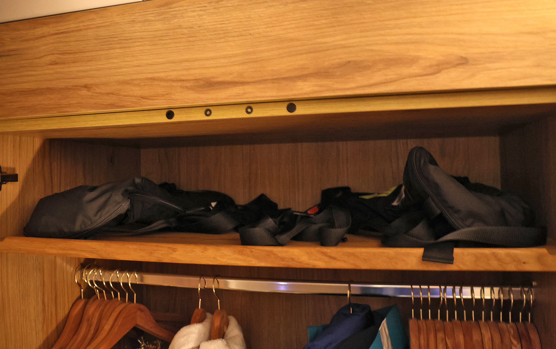 a shelf with clothes on it