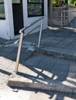 a railing on a sidewalk