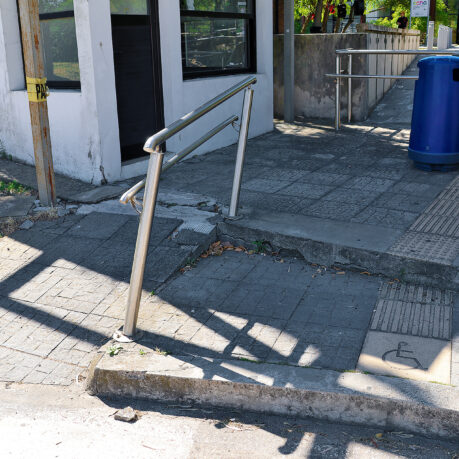 a railing on a sidewalk