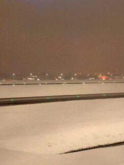 a snowy runway at night