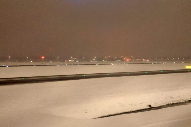 a snowy runway at night