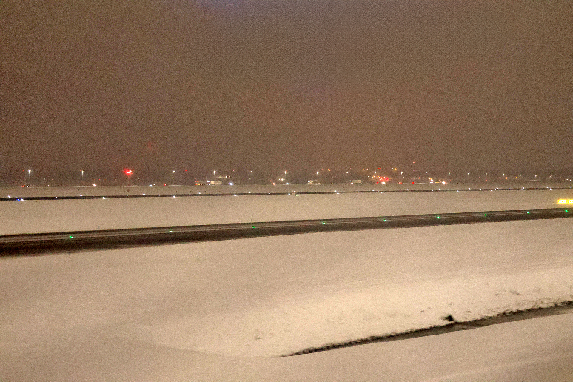 a snowy runway at night