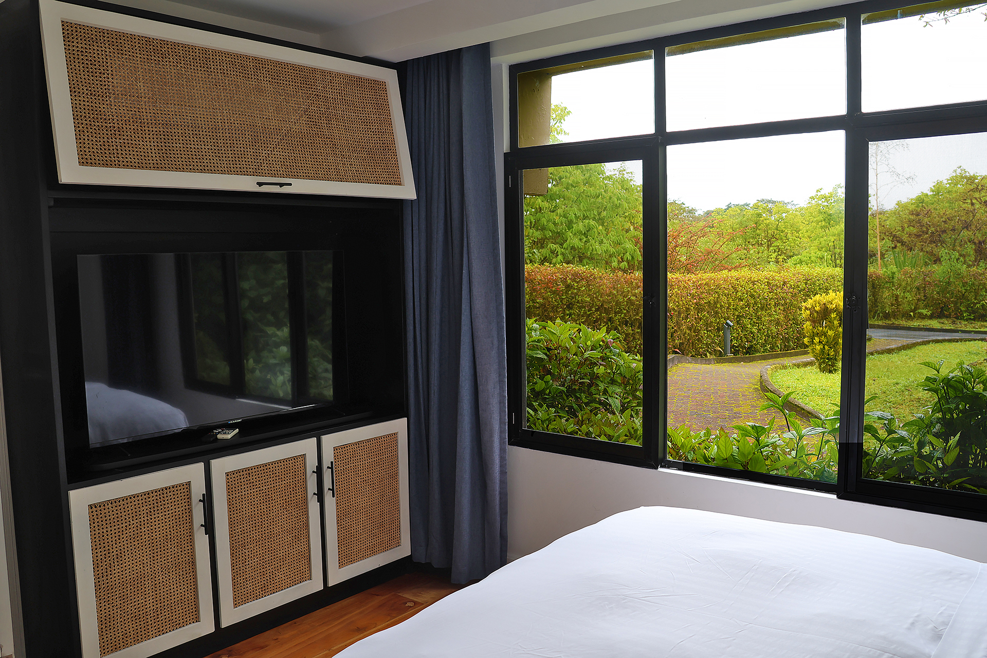 a room with a television and a window