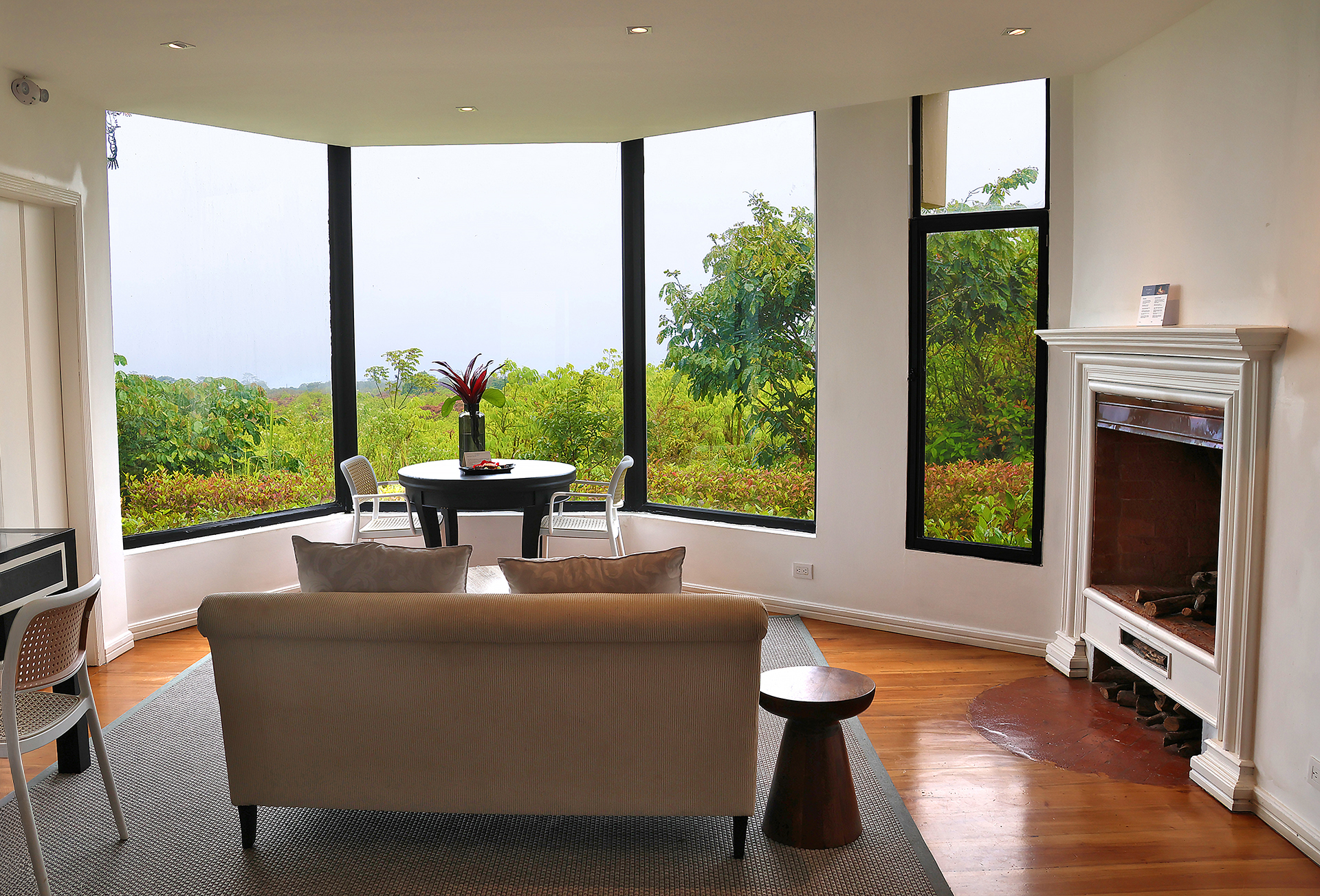 a living room with a fireplace and a table