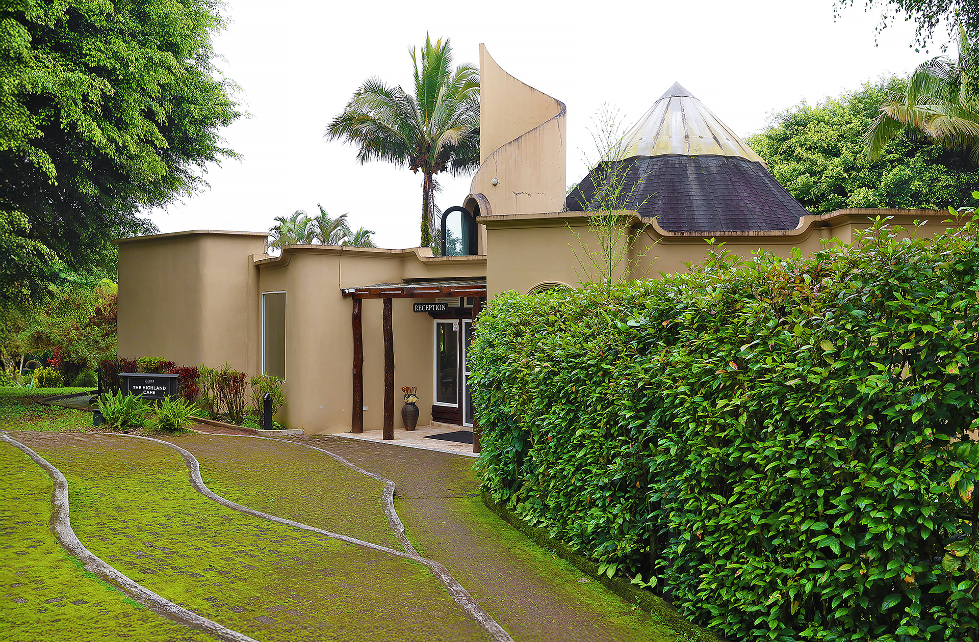 a house with a path and bushes