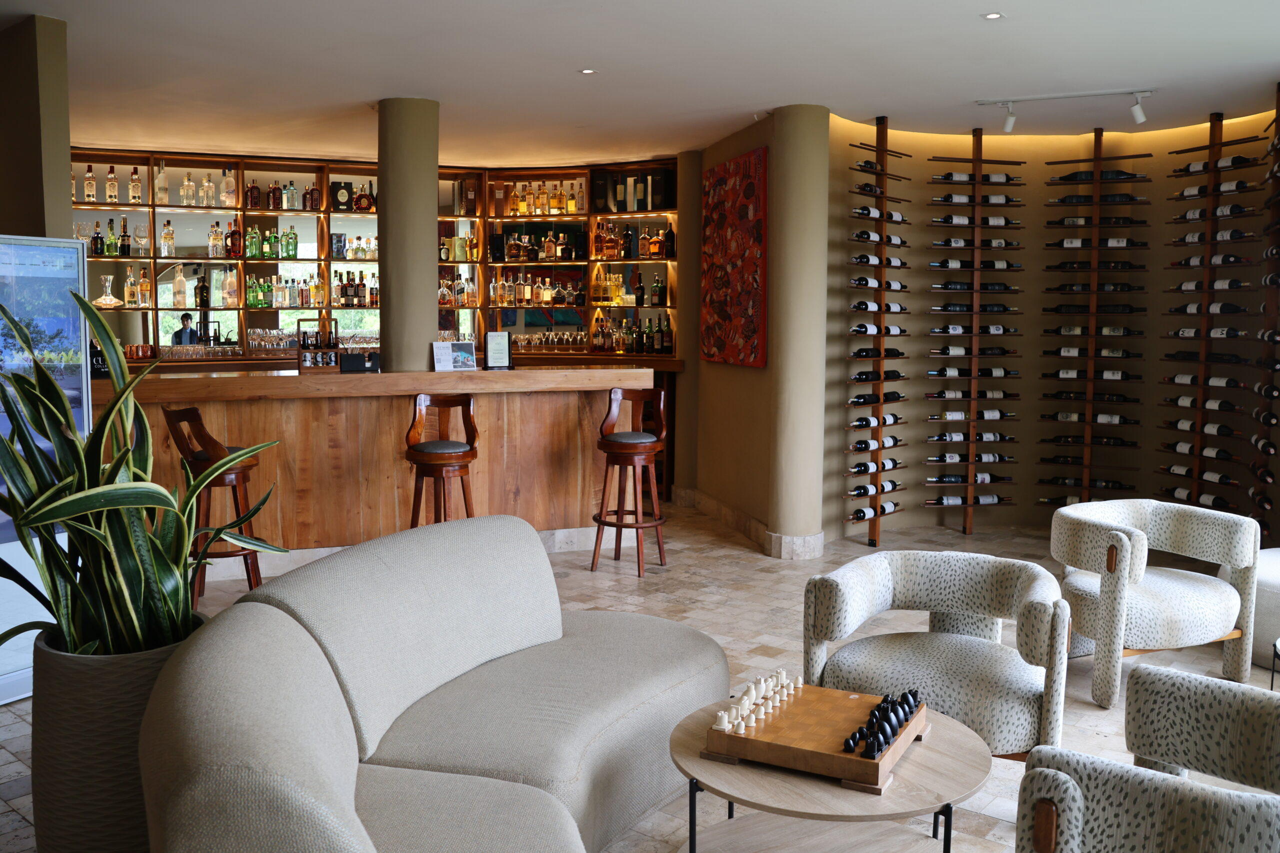 a room with a bar and a table and chairs