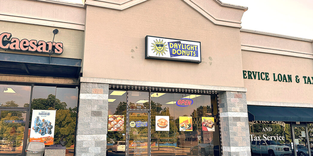 a store front with a sign on the front