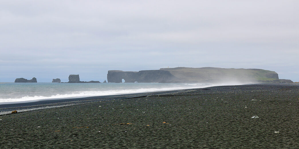 a beach with rocks and water
