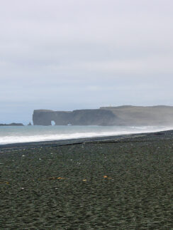 a beach with rocks and water