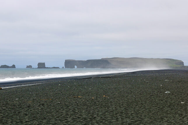 a beach with rocks and water