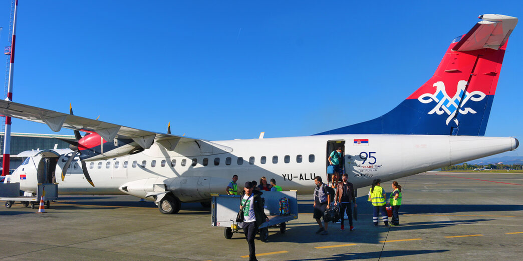 a group of people boarding an airplane