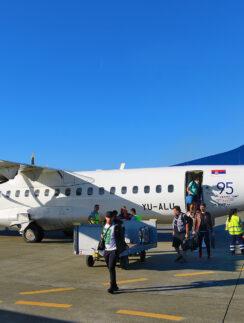 a group of people boarding an airplane