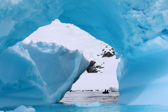 a group of people in a boat in a snowy area
