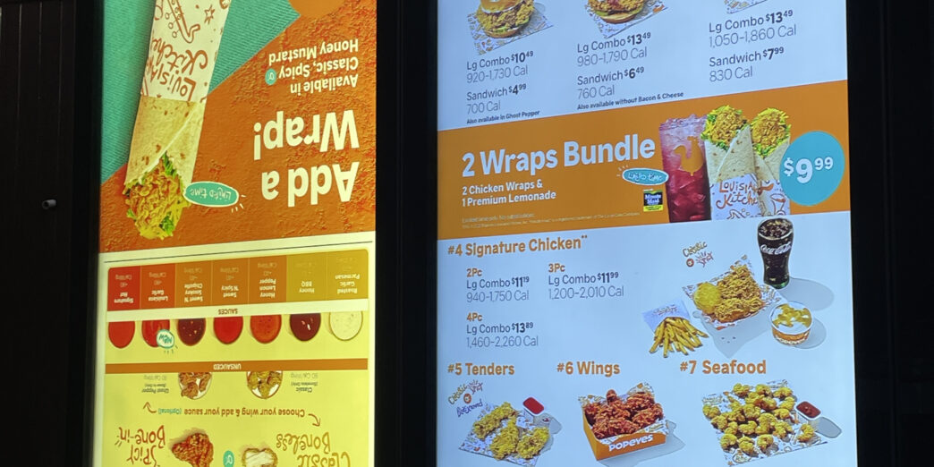 a menu board with images and text